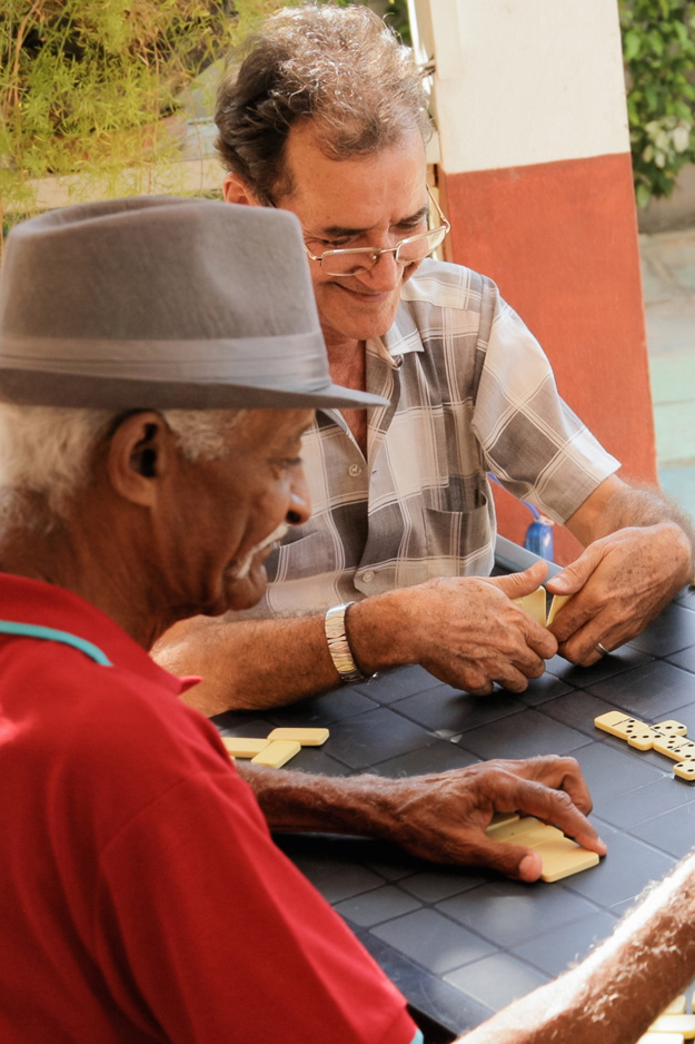 Senior men playing dominoes